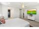 Main bedroom with en-suite bathroom and large TV at 17543 E Silver Sage Ln, Rio Verde, AZ 85263