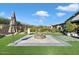 Artificial turf backyard with fire pit and patio at 17543 E Silver Sage Ln, Rio Verde, AZ 85263