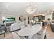 Open concept living, kitchen, and dining area with large windows at 17543 E Silver Sage Ln, Rio Verde, AZ 85263