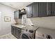 Laundry room with washer, dryer, and ample cabinet space at 17543 E Silver Sage Ln, Rio Verde, AZ 85263