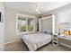Guest bedroom with a murphy bed and built-in desk at 17543 E Silver Sage Ln, Rio Verde, AZ 85263