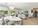 Elegant dining area with an oval table and chandelier at 17543 E Silver Sage Ln, Rio Verde, AZ 85263