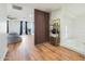 Hallway with wood flooring, wooden partition, and built-in shelving at 17743 W Evans Dr, Surprise, AZ 85388