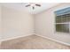 Spacious bedroom with carpet, window and ceiling fan at 8543 W Candlewood Way, Florence, AZ 85132