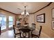 Charming breakfast nook with glass table and French doors at 5123 E Mcdonald Dr, Paradise Valley, AZ 85253