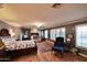 Large main bedroom with hardwood floors, fireplace, and sitting area at 5123 E Mcdonald Dr, Paradise Valley, AZ 85253