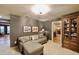 Cozy sitting room with sectional sofa, built-in shelving, and hardwood floors at 5123 E Mcdonald Dr, Paradise Valley, AZ 85253