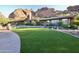 Beautiful home exterior with lush landscaping and mountain backdrop at 5123 E Mcdonald Dr, Paradise Valley, AZ 85253
