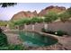 Inviting kidney shaped pool with flagstone decking at 5123 E Mcdonald Dr, Paradise Valley, AZ 85253