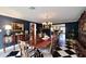 Formal dining room with dark blue walls and a wood table at 5123 E Mcdonald Dr, Paradise Valley, AZ 85253