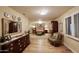 Elegant Primary bedroom with a four-poster bed and hardwood floors at 5123 E Mcdonald Dr, Paradise Valley, AZ 85253