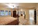 Elegant Primary bedroom with a four-poster bed and hardwood floors at 5123 E Mcdonald Dr, Paradise Valley, AZ 85253
