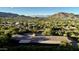 Aerial view showcasing the home's location and mountain views at 5123 E Mcdonald Dr, Paradise Valley, AZ 85253