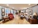 Relaxing living room with hardwood floors, comfortable seating, and access to backyard at 5123 E Mcdonald Dr, Paradise Valley, AZ 85253