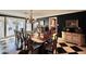 Elegant dining room with a large table, chandelier, and checkerboard floor at 5123 E Mcdonald Dr, Paradise Valley, AZ 85253