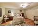 Charming bedroom with antique brass bed, hardwood floors, and built-in closet at 5123 E Mcdonald Dr, Paradise Valley, AZ 85253