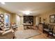 Bright home office features built-in bookshelves and hardwood floors at 5123 E Mcdonald Dr, Paradise Valley, AZ 85253