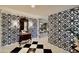 Elegant entryway with patterned wallpaper and a checkerboard floor at 5123 E Mcdonald Dr, Paradise Valley, AZ 85253