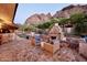 Spacious backyard patio with fireplace and seating area, offering mountain views at 5123 E Mcdonald Dr, Paradise Valley, AZ 85253