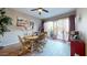 Dining area with round table and access to backyard patio at 17447 N 99Th Dr, Sun City, AZ 85373