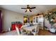 Bright dining room featuring a wood table and hutch at 17447 N 99Th Dr, Sun City, AZ 85373