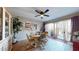 Dining area with round table and access to backyard patio at 17447 N 99Th Dr, Sun City, AZ 85373