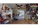 Hallway with wood-look tile floor, showing views into living and dining areas at 17447 N 99Th Dr, Sun City, AZ 85373