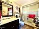 Clean bathroom with updated vanity, shower, and tile flooring at 17447 N 99Th Dr, Sun City, AZ 85373