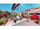 Brick patio with pergola, umbrella, and seating area at 17447 N 99Th Dr, Sun City, AZ 85373