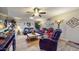 Living room with leather reclining sofas and tile floor at 17447 N 99Th Dr, Sun City, AZ 85373