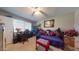 Cozy bedroom with a daybed, desk, and window seating at 17447 N 99Th Dr, Sun City, AZ 85373