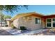 Tan single-story home with walkway and landscaping at 17447 N 99Th Dr, Sun City, AZ 85373