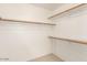 Walk in closet with wood shelving and hanging rods at 7959 W Waltann Ln, Peoria, AZ 85382