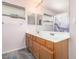 Double vanity bathroom with wood cabinets and a shower/tub combo at 7959 W Waltann Ln, Peoria, AZ 85382