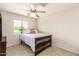 Bedroom with double bed, ceiling fan and window with blinds at 7959 W Waltann Ln, Peoria, AZ 85382