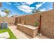 Backyard with a built-in planter and a small garden at 7959 W Waltann Ln, Peoria, AZ 85382