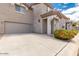 Tan two-story townhome with a garage and landscaping at 7959 W Waltann Ln, Peoria, AZ 85382