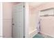 Bathroom with tub shower combo, wood vanity, and gray floor tiles at 7959 W Waltann Ln, Peoria, AZ 85382