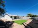 Private backyard oasis with sparkling pool and grassy area at 1737 N Trevor Dr, Mesa, AZ 85201