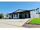 Modern home with covered carport and well-manicured lawn at 1737 N Trevor Dr, Mesa, AZ 85201