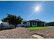 Newly renovated home with modern exterior and a landscaped yard at 1737 N Trevor Dr, Mesa, AZ 85201