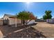 Landscaped backyard with covered patio and storage shed at 15840 N 22Nd St, Phoenix, AZ 85022