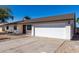 White single story home with attached garage and nicely paved driveway at 15840 N 22Nd St, Phoenix, AZ 85022