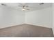 Spacious bedroom with ceiling fan and neutral carpeting at 15840 N 22Nd St, Phoenix, AZ 85022