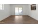 Dining area with wood-look flooring and sliding glass doors leading to the backyard at 15840 N 22Nd St, Phoenix, AZ 85022
