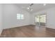 Bright bedroom with wood look floors and sliding glass doors to backyard at 15840 N 22Nd St, Phoenix, AZ 85022