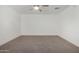 Bright bedroom featuring neutral carpeting and a ceiling fan at 15840 N 22Nd St, Phoenix, AZ 85022