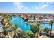 Aerial view of lakefront community with palm trees and homes at 240 S Old Litchfield Rd # 220, Litchfield Park, AZ 85340