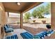 Relaxing backyard with covered patio, gravel landscaping, and space for seating at 22608 W Gardenia Dr, Buckeye, AZ 85326