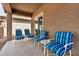Covered patio with comfortable seating and a small table at 22608 W Gardenia Dr, Buckeye, AZ 85326